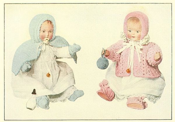 tinted photo of baby dolls in blue and pink outfits